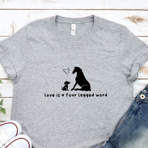 Horse & Dog Lover T-Shirt: Love Is A Four Legged Word — by Van der Merwe Studio — Clothing & Apparel — handmade in South Africa